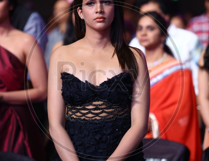 Tollywood Actress Lavanya Tripati standing in a black dress
