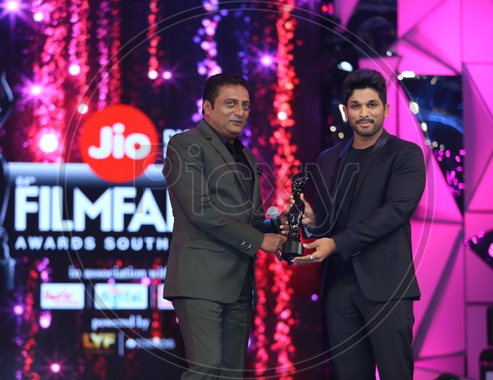 Tollywood Actor Allu Arjun receiving a Filmfare award