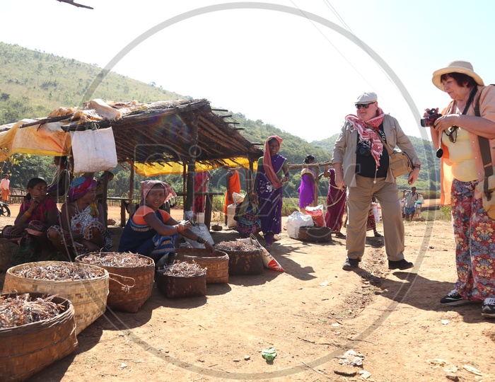 Foreigners Or Tourists Documenting The Bonda Tribes Lifestyle  At Local Flea Markets  in Tribal Villages At Andhra odisha Border