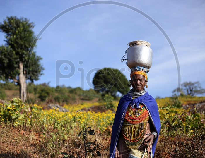 Bonda Tribal Woman Walking on Pathways to Agricultural Fields in Tribal Villages