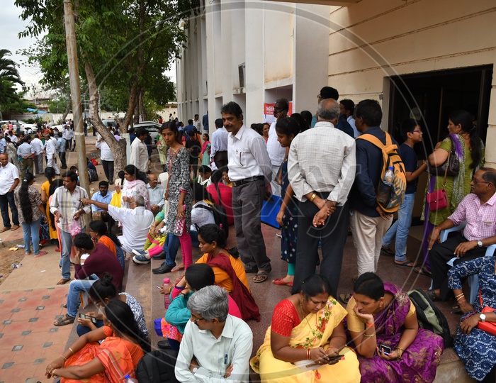 Parents waiting along with their children during AP MBBS Counselling