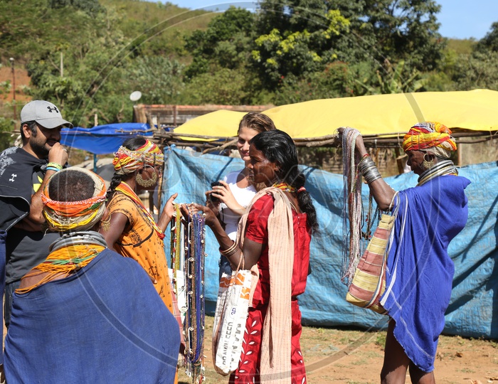 Foreigners Or tourists Purchasing Local Handmade Art Crafts From Bonda Tribe People At a Local Market in Tribal Villages