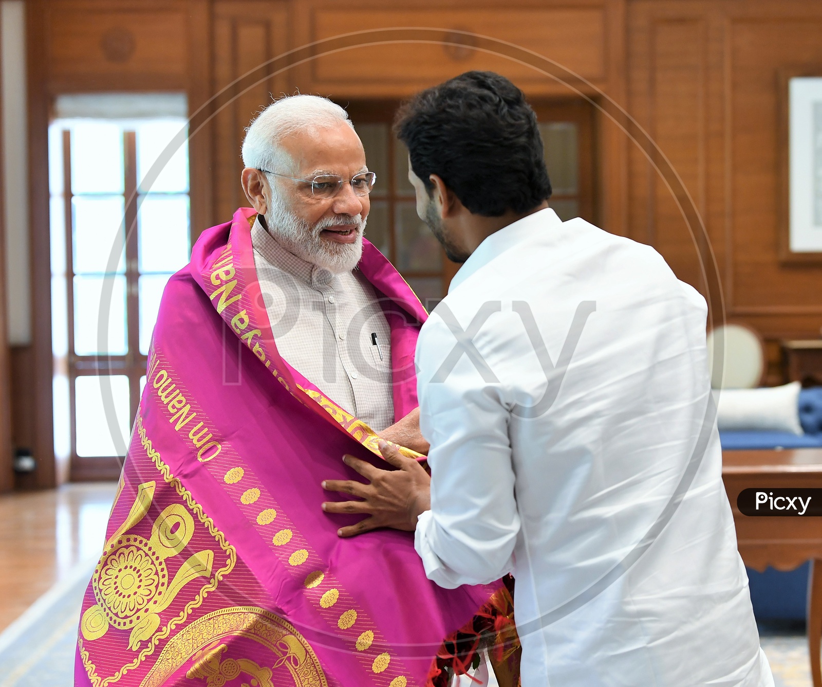 AP CM YS Jagan Mohan Reddy felicitating PM Narendra Modi