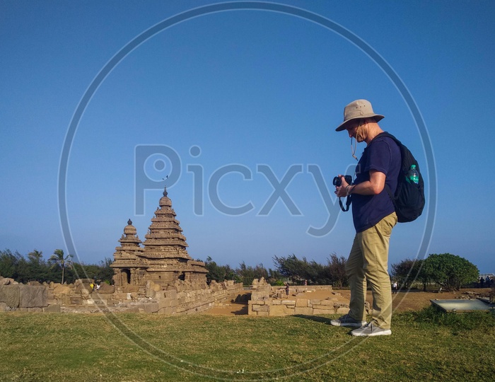 Foreigner Taking photos of various temples at Mahabalipuram