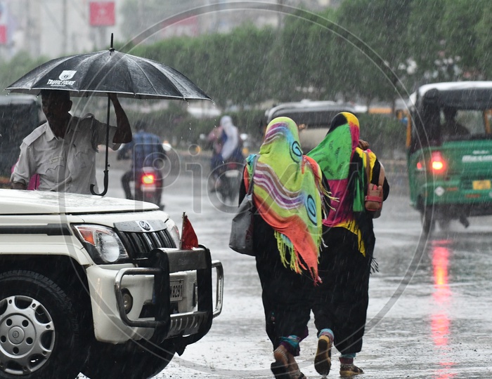 Muslim Woman Walking on Vijayawada Roads In Heavy Rains