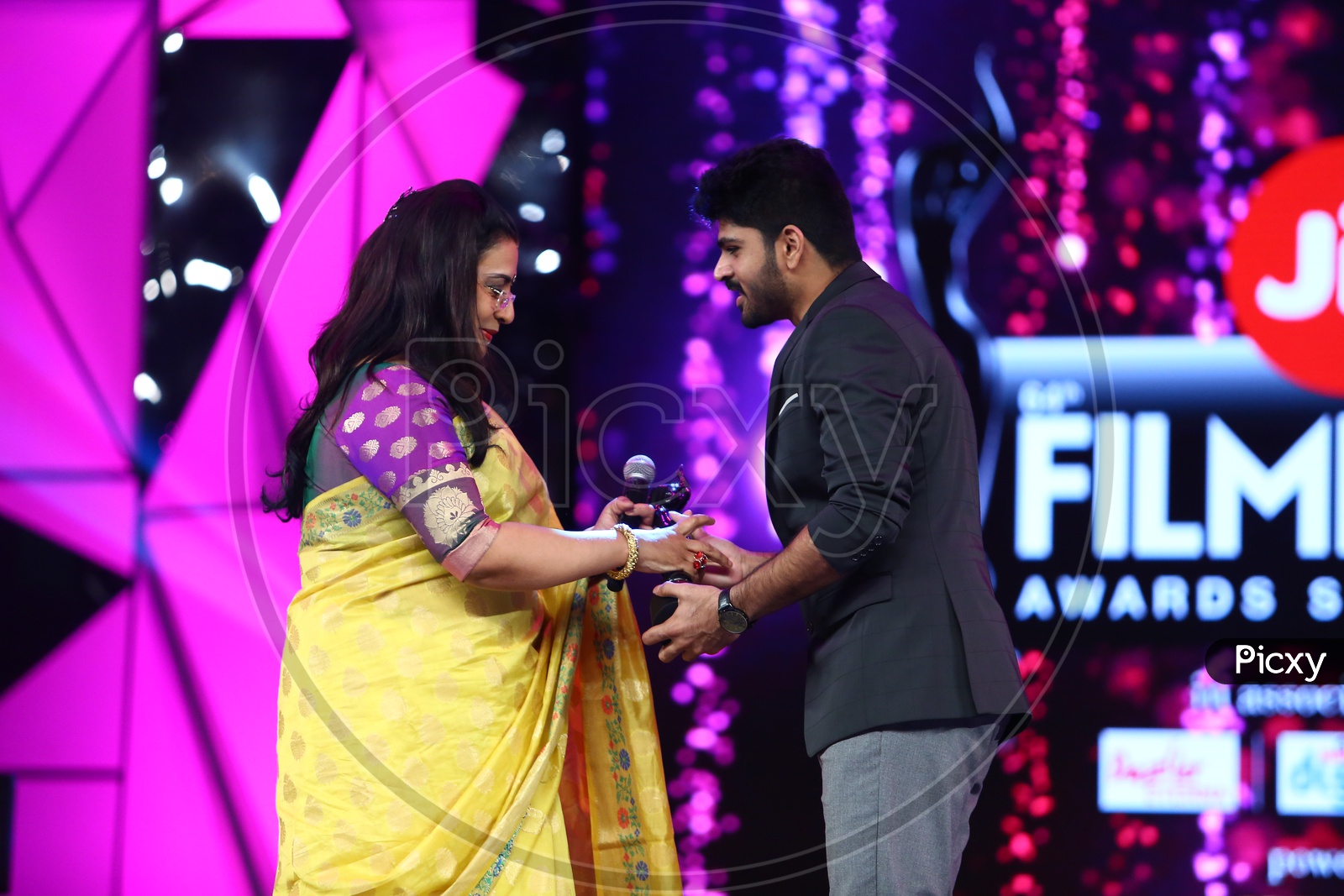 Malayalam Actors Taking Shields On Stage At Film Fare Awards Event
