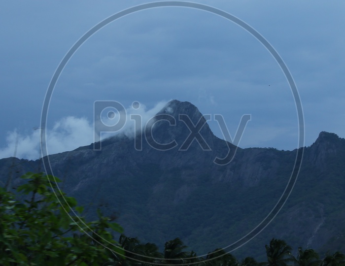 Fog Clouds Over Green Terrain Hill Passes In Munnar