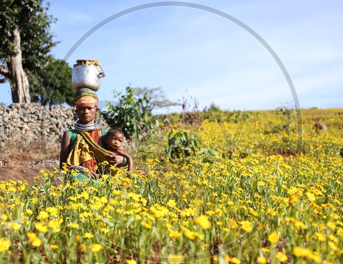 Bonda Tribal Woman With Her Child In Tribal Village Agricultural Fields at Andhra Odisha Border