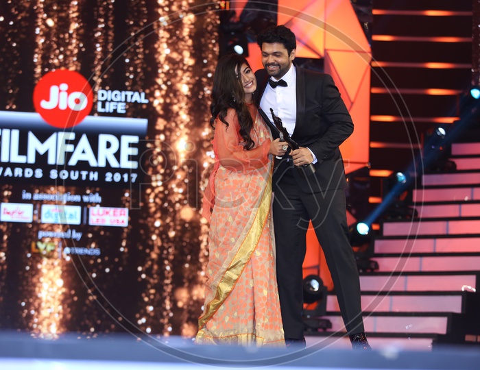 Tollywood Actress Rashmika Mandana receiving Filmfare award