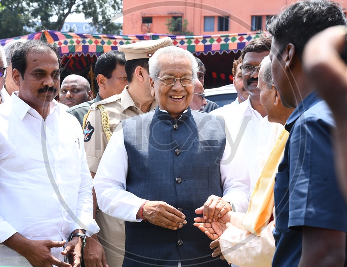 Governor Biswabhusan Harichandan smiling at the entrance