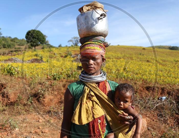 Bonda Tribal Woman With Her Child In Tribal Villages Agricultural Fields