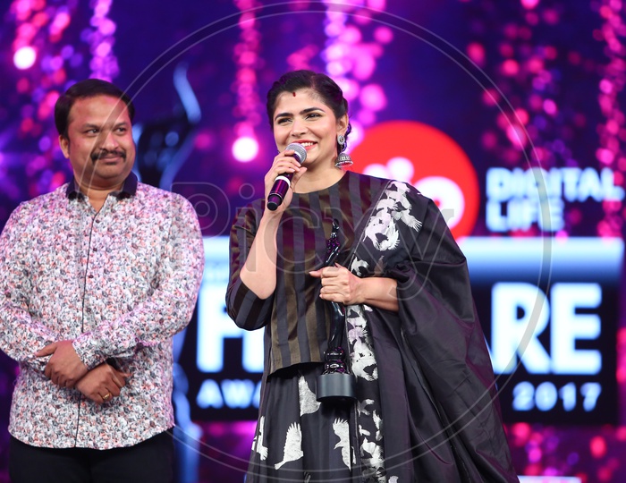 Singer Chinmay Sripada addressing a speech during Filmfare Awards South 2017
