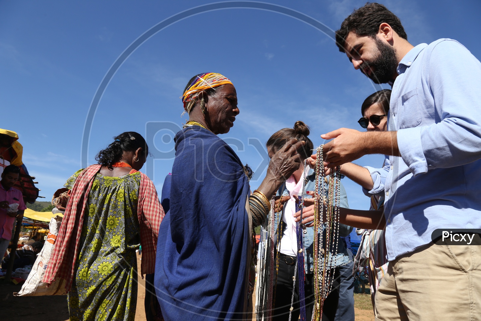 Foreigners Or tourists Purchasing Handmade Art Crafts  From Bonda Tribal Woman In tribal Village flea Market