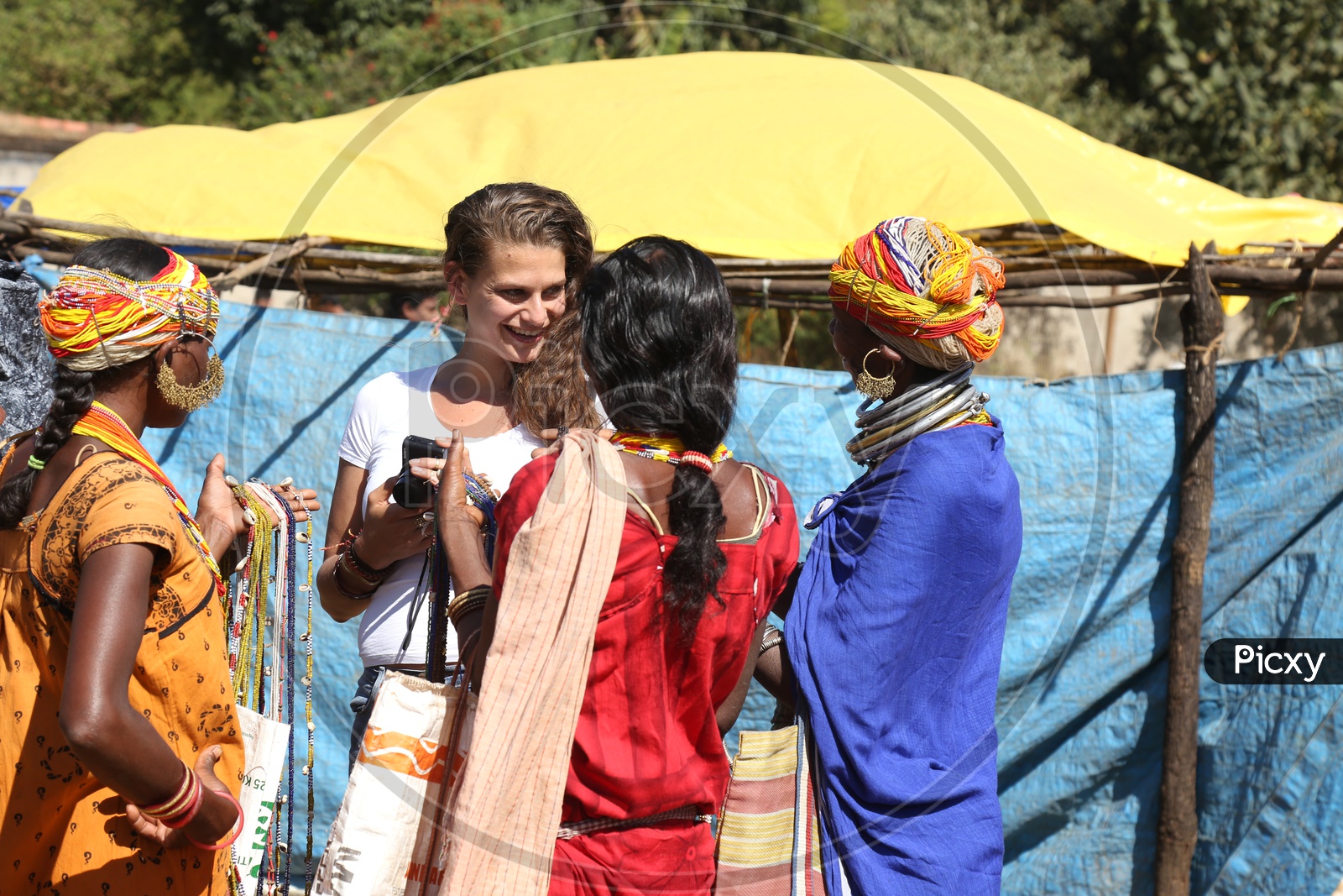 Foreigners Or tourists Purchasing Local Handmade Art Crafts From Bonda Tribe People At a Local Market in Tribal Villages