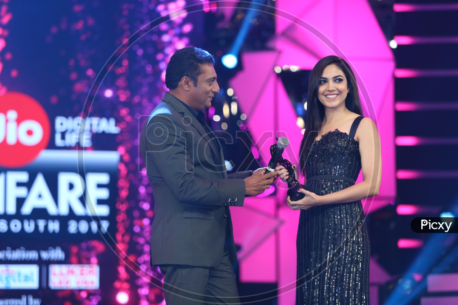 Tollywood Actress Ritu Varma receiving a filmfare award