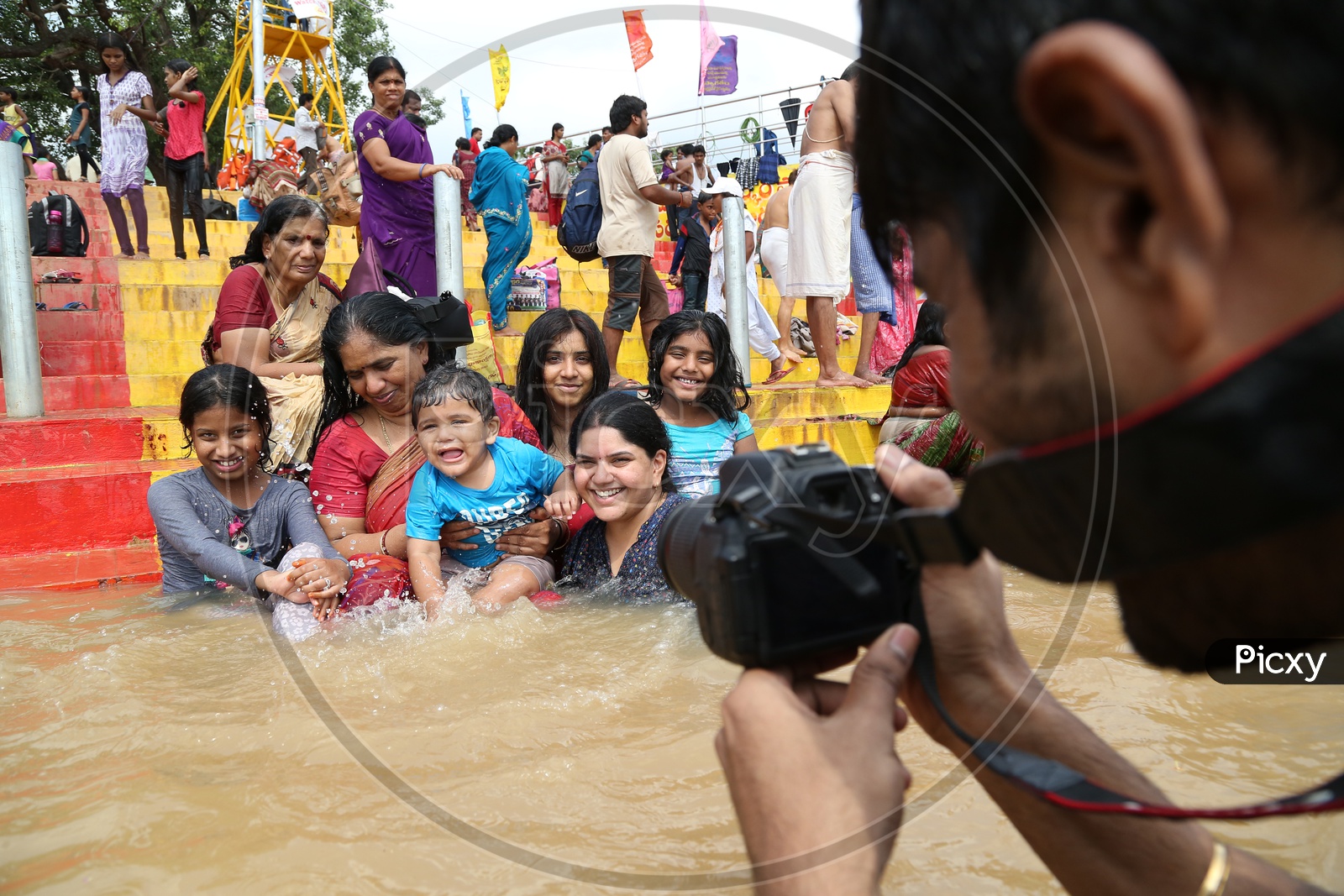 Indian Hindu Devotees Taking Holy Bath In River krishna During Pushkaralu