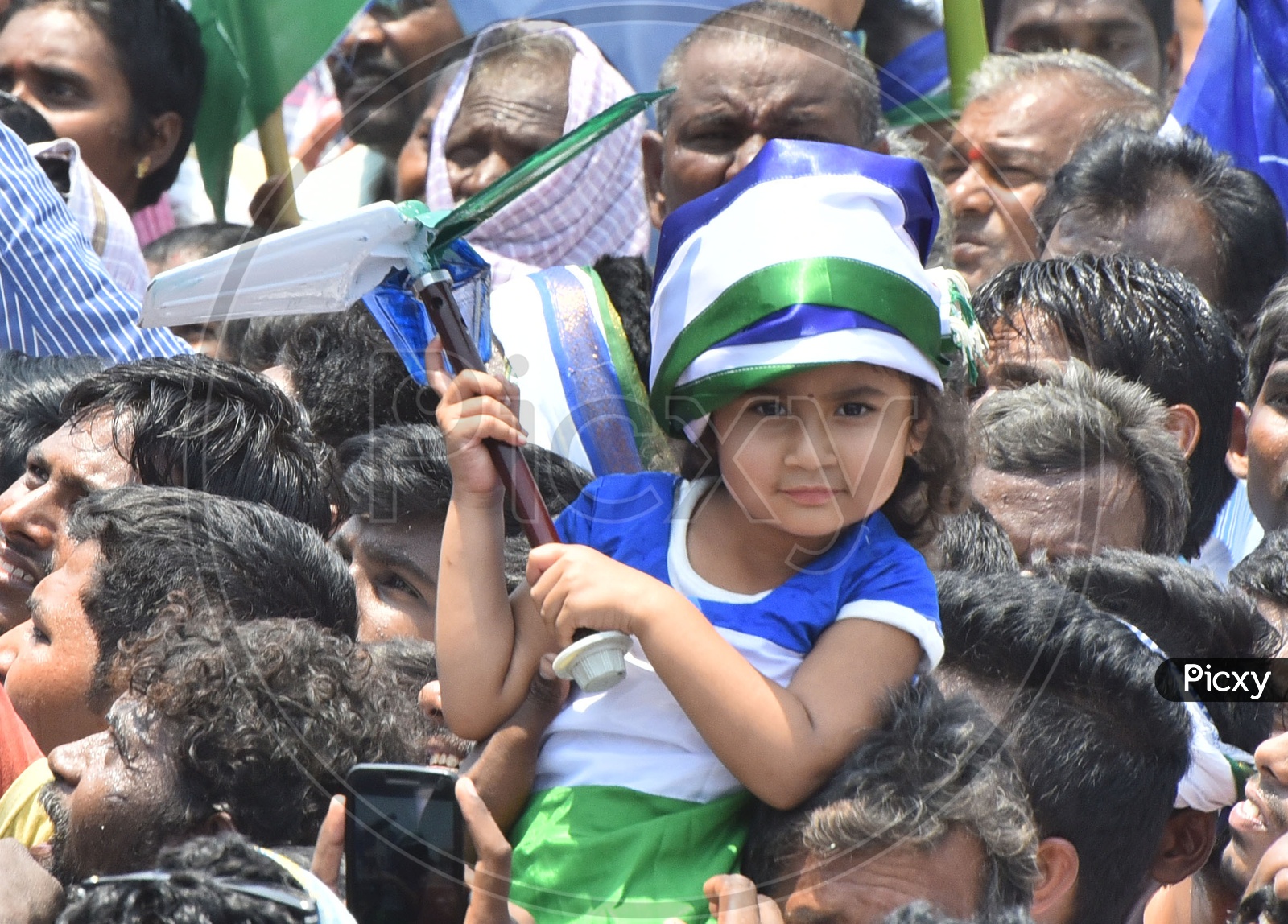 A Little girl showing her support to YSRCP Party during Election Campaign