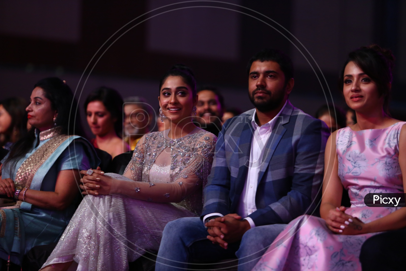 Tollywood Actress Regina Cassandra sitting beside Niving Pauly during Filmfare Awards South 2017