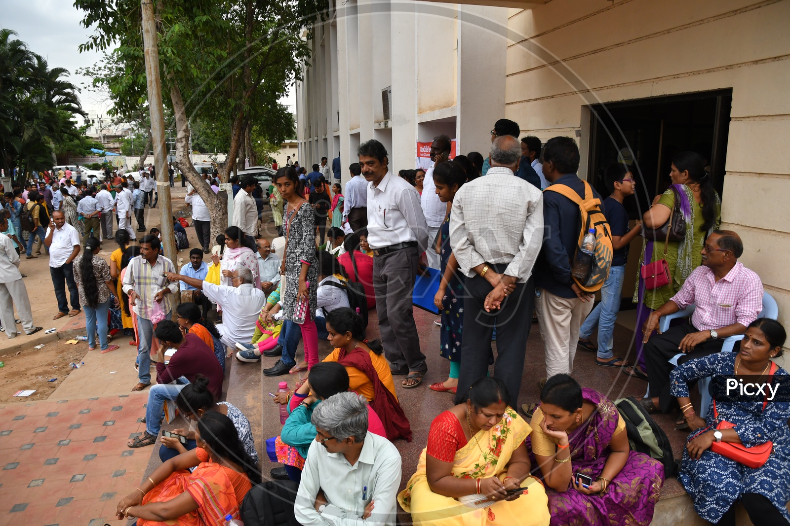 Parents waiting along with their children during AP MBBS Counselling