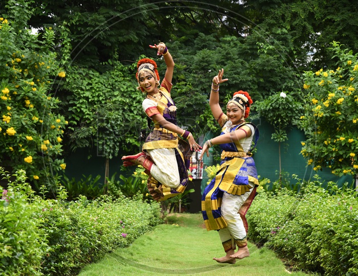 Indian Girls rehearsing Bharatanatyam Dance in the Lawn