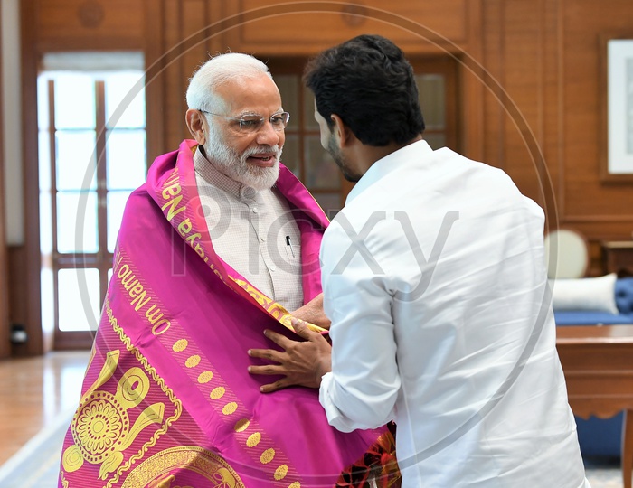 AP CM YS Jagan Mohan Reddy felicitating PM Narendra Modi