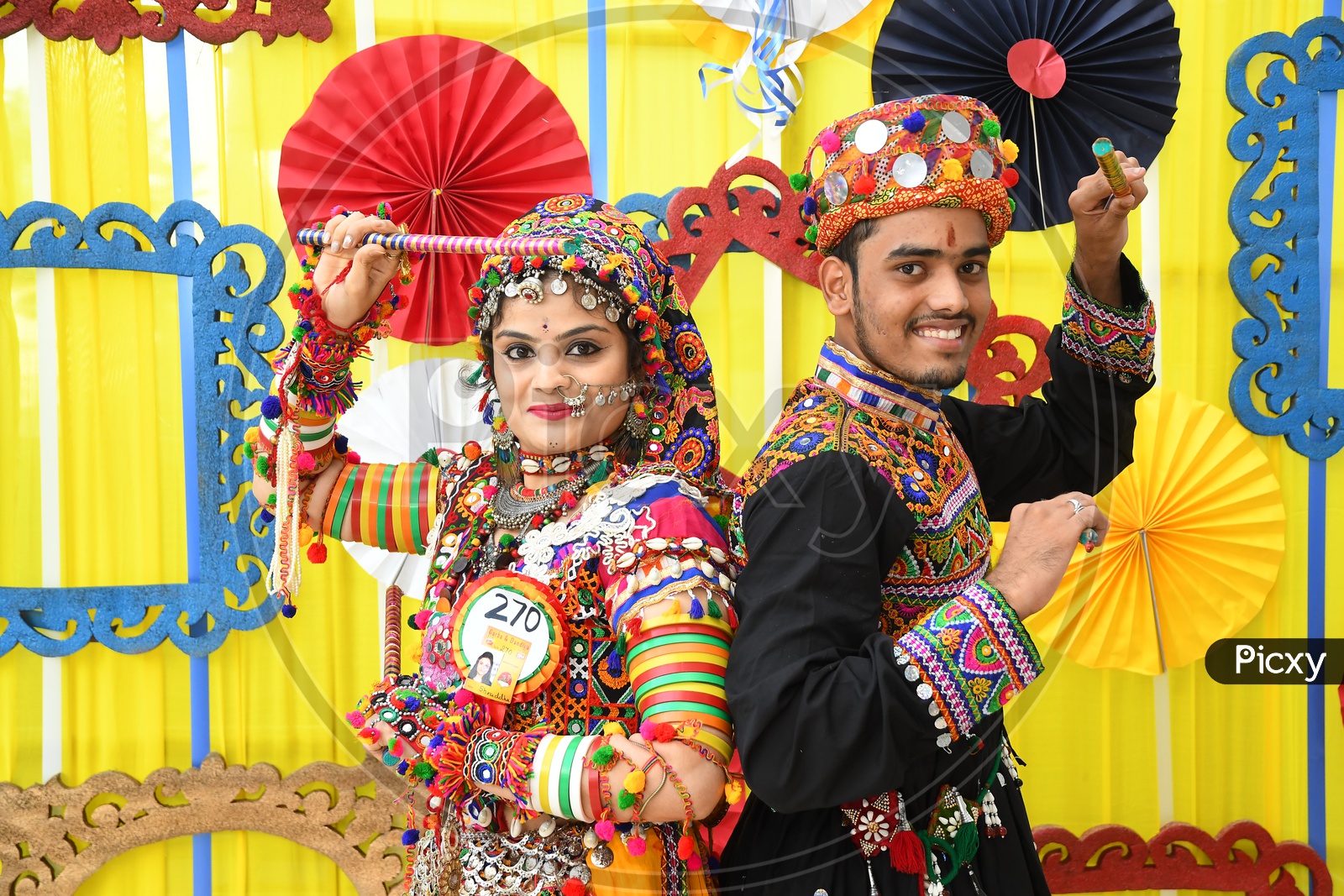 Traditional Gujrati Couple Playing Dandiya Ras Garba On-Navratri Festival