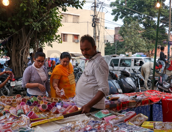 Women buying bangles at a street vendor on the eve of Karva chauth