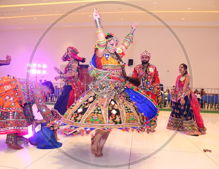 Indian Woman Playing or Dancing at   Garba Dandiya Raas  For Durga Navrathri