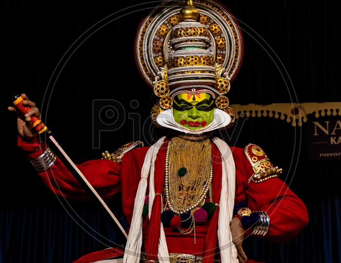 Artist Performing  Kathakali Dance , A Story Telling Play Dance Art Form  on Stage