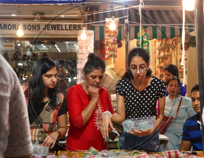 Women buying bangles at a stall on the eve of Karva chauth