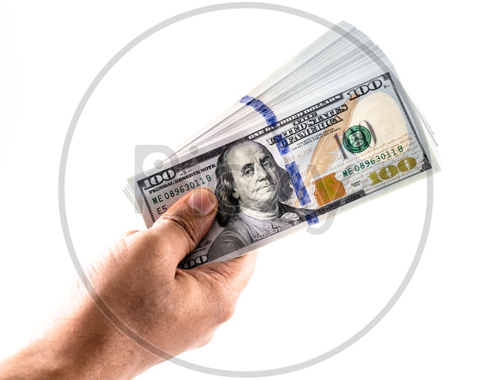 A Man Hand Holding US 100 Dollar Bills Or Currency Notes in Hand Closeup Over an Isolated White Background