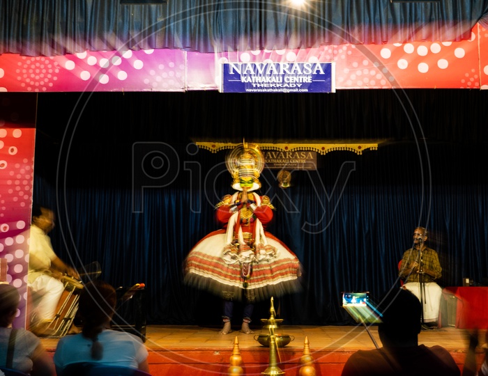 Artist Performing  Kathakali Dance , A Story Telling Play Dance Art Form  on Stage