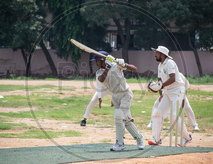 Young Indian Cricket Players Playing Cricket Match In a Ground