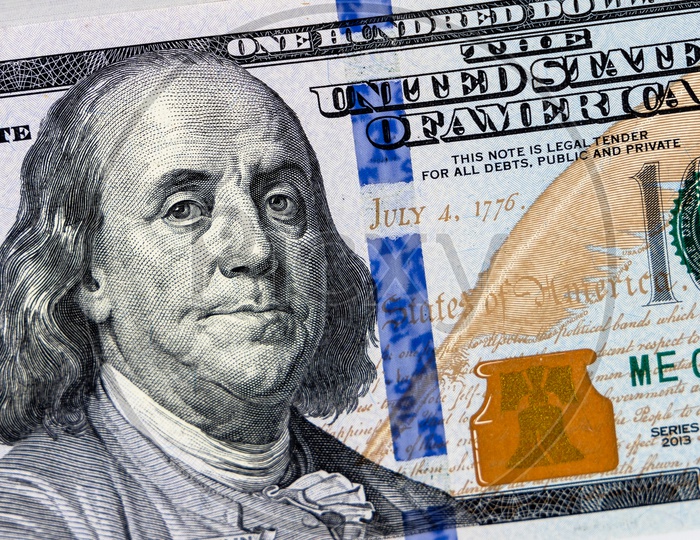 Benjamin Franklin on hundred dollar US note.
