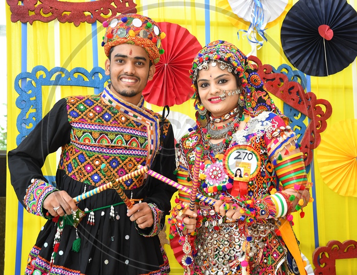 Beautiful Indian Couple  in Traditional Dress At Garba Dandiya Raas Event as a Part Of Durga Navratri