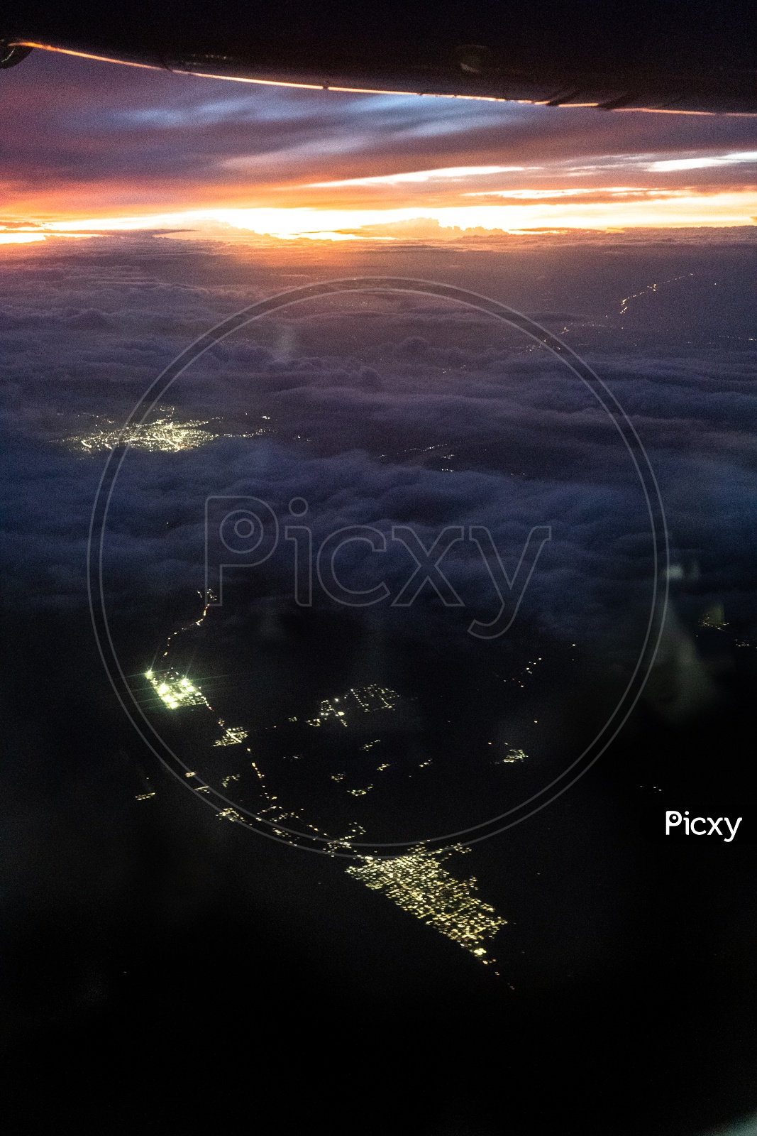 Aerial View Of City  Night Scape  From Flight Window