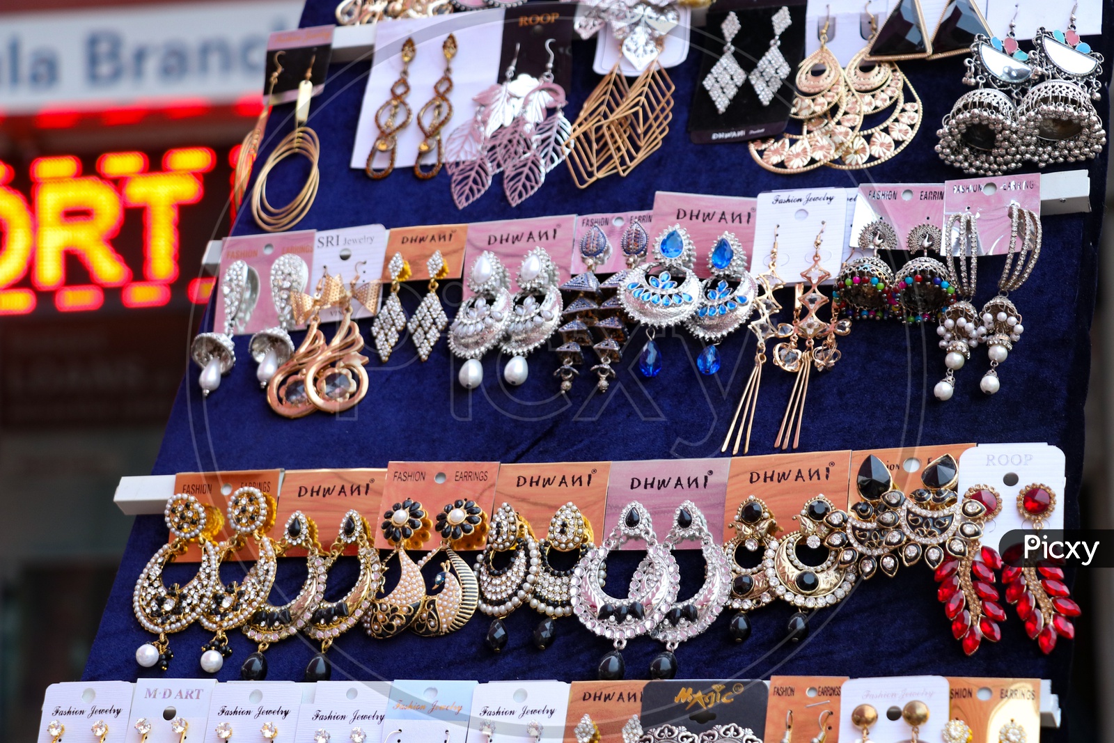 Various Designs Of Ear Tops In Display At a Stall