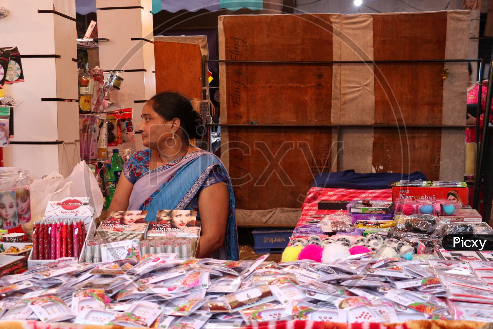 A woman street vendor selling fancy items