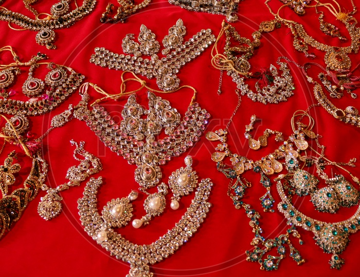 Imitation Jewelery Placed Arbitrarily On red Cloth