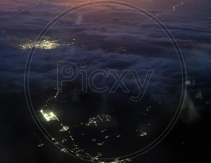 Aerial View Of City  Night Scape  From Flight Window