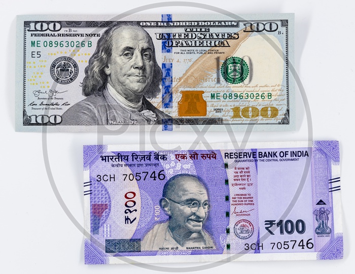 Indian 100 Rupee Currency Note With US 100 Dollar  Bill On an isolated White Background