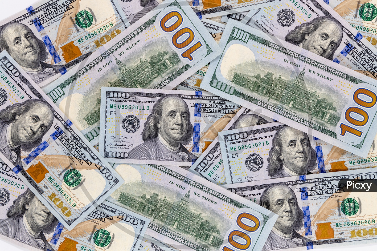 US 100 Dollar Currency Notes or Dollar Bills Closeup on an Isolated White Background