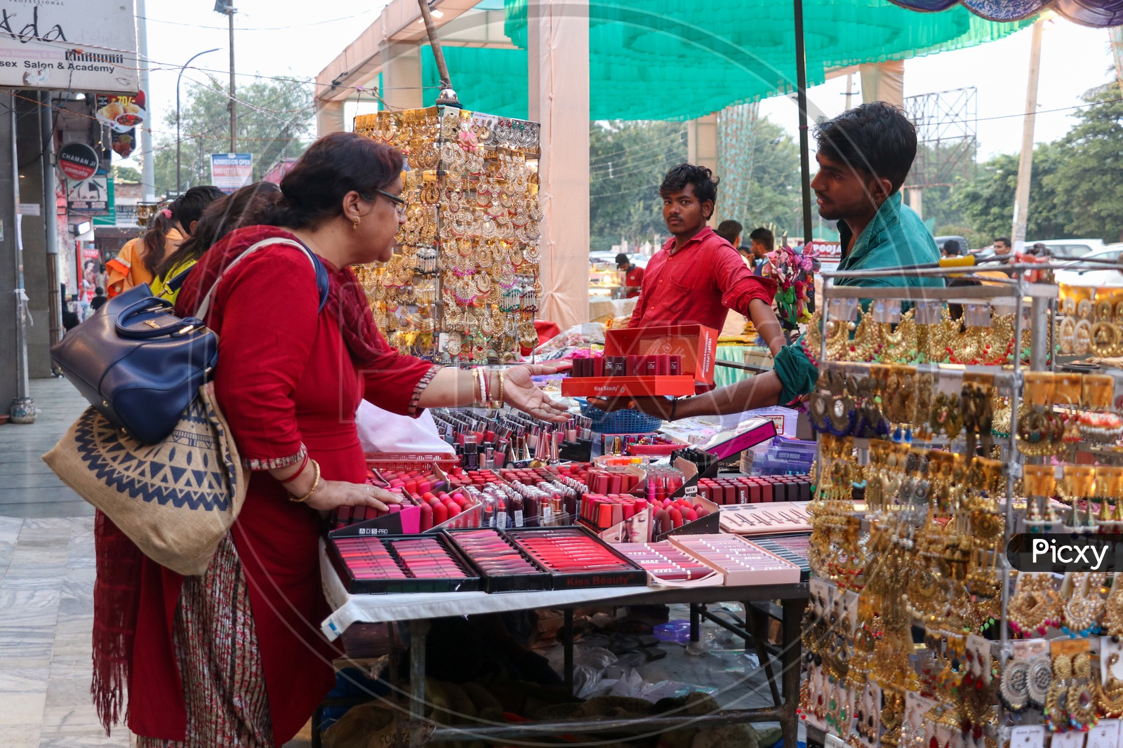 Indian Woman Buying Cosmetics At a Stall