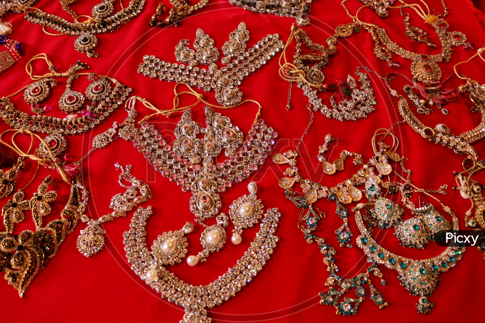 Imitation Jewelery Placed Arbitrarily On red Cloth