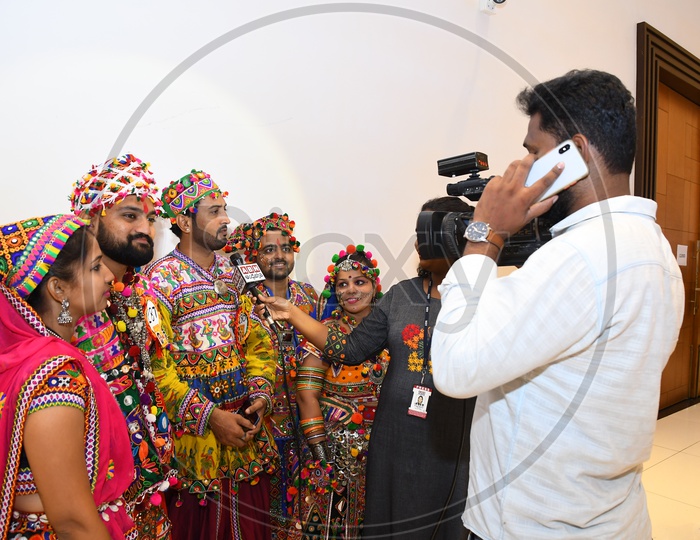 TV Reporters Taking Interview Of Dancers At Garba Dhandiya Raas Event
