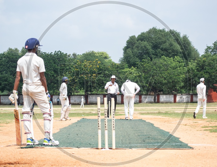 Cricket Players Playing Cricket In a Ground