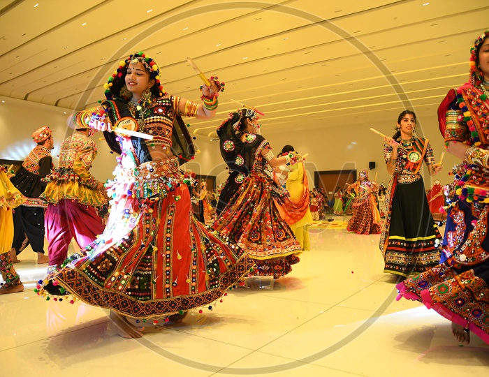 Indian Woman Playing or Dancing at   Garba Dandiya Raas  For Durga Navrathri