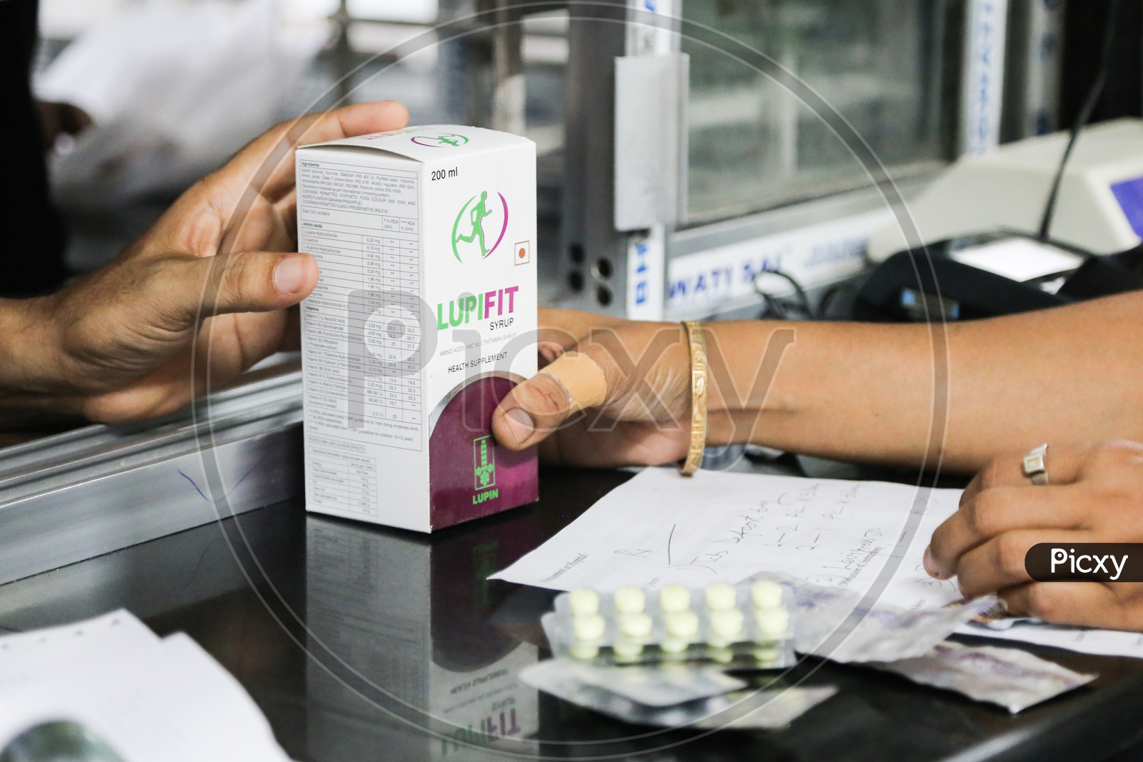 Women taking Medicines in Pharmacy shop