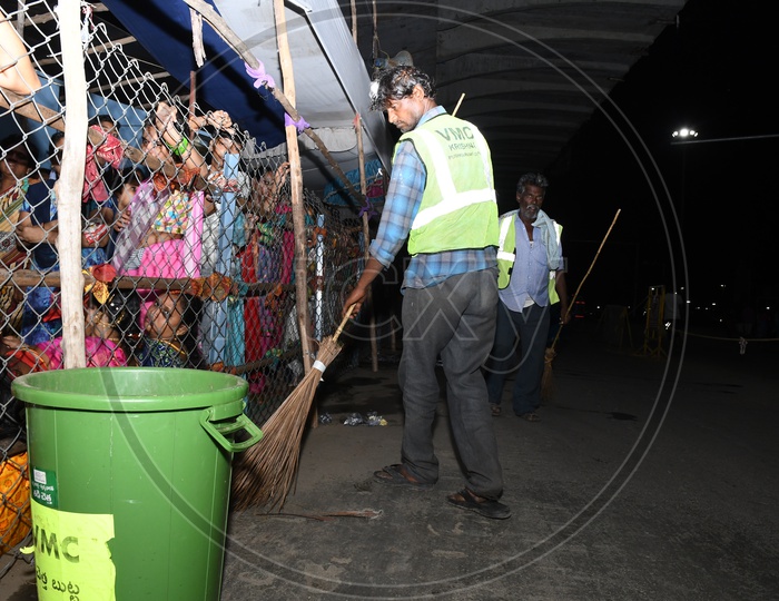 Image of Vijayawada Municipal Corporation VMC Sanitary Workers Cleaning
