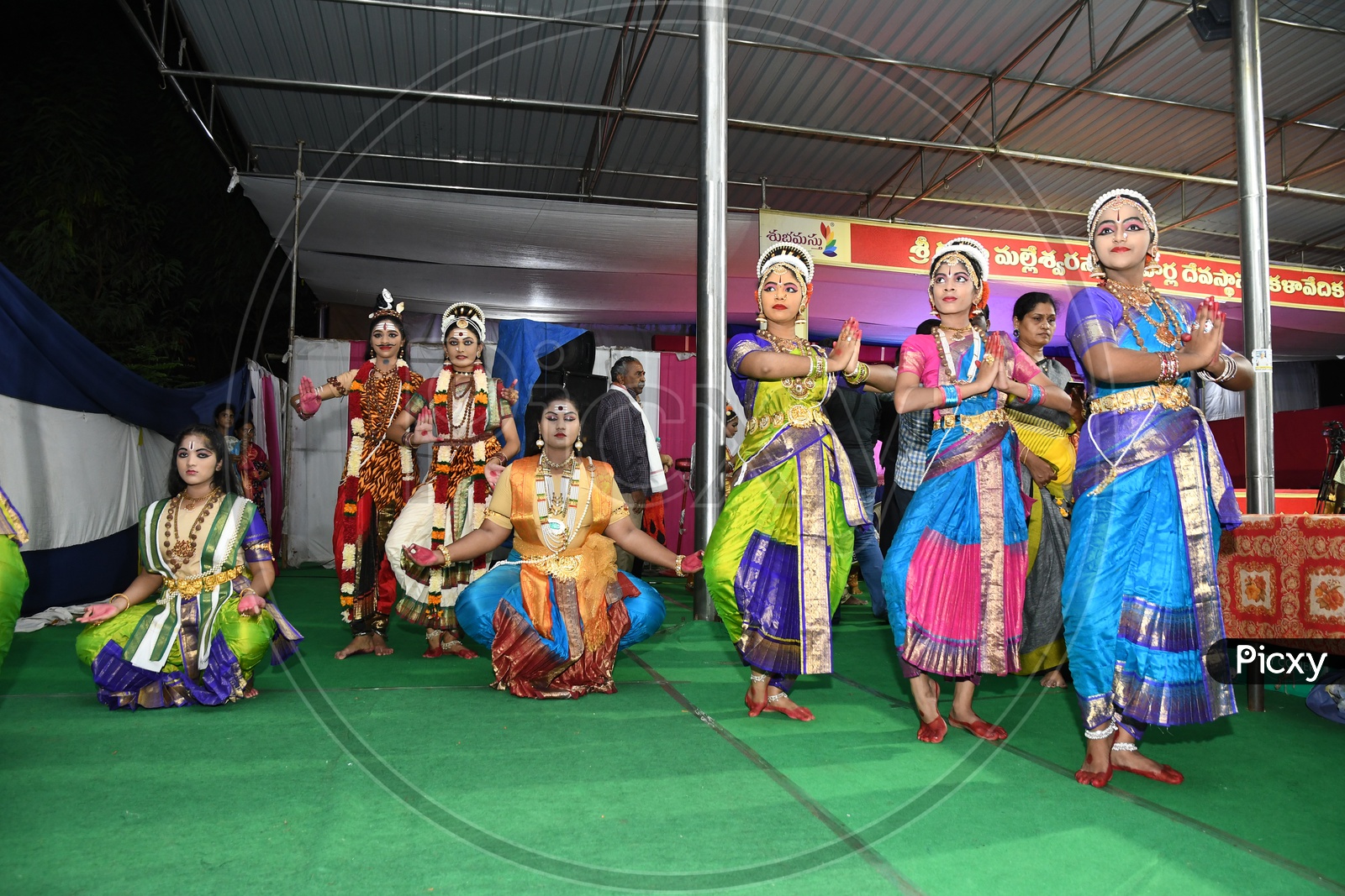 Indian Classical Dancers Performing On Stage At an Cultural Event